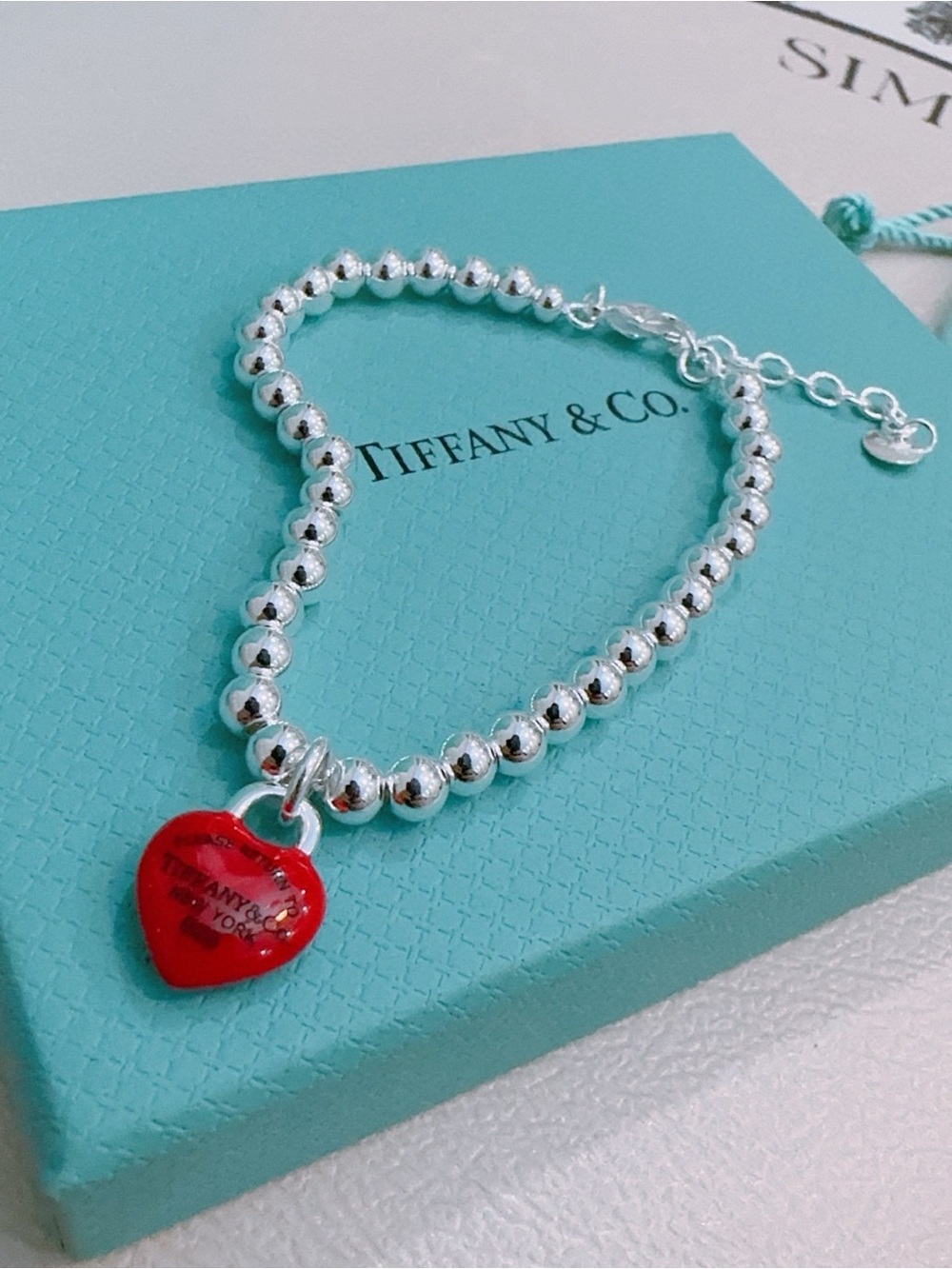 Tiffany & Co. Silver Bead Bracelet with Red Heart Pendant
